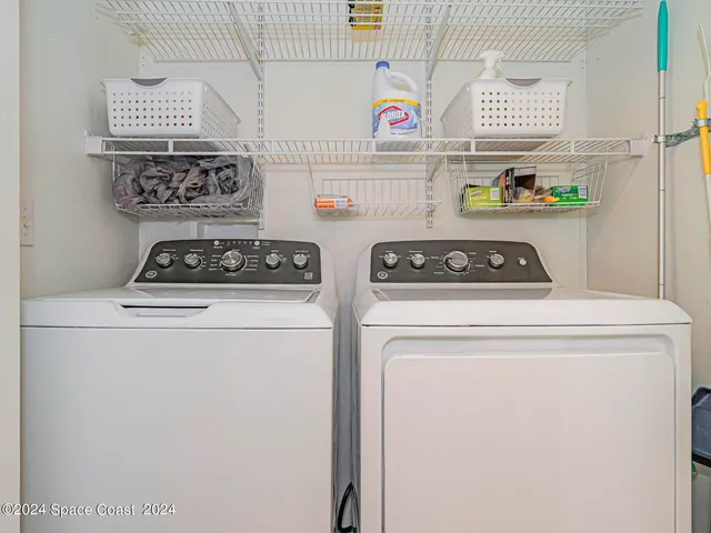 a utility room with washer and dryer