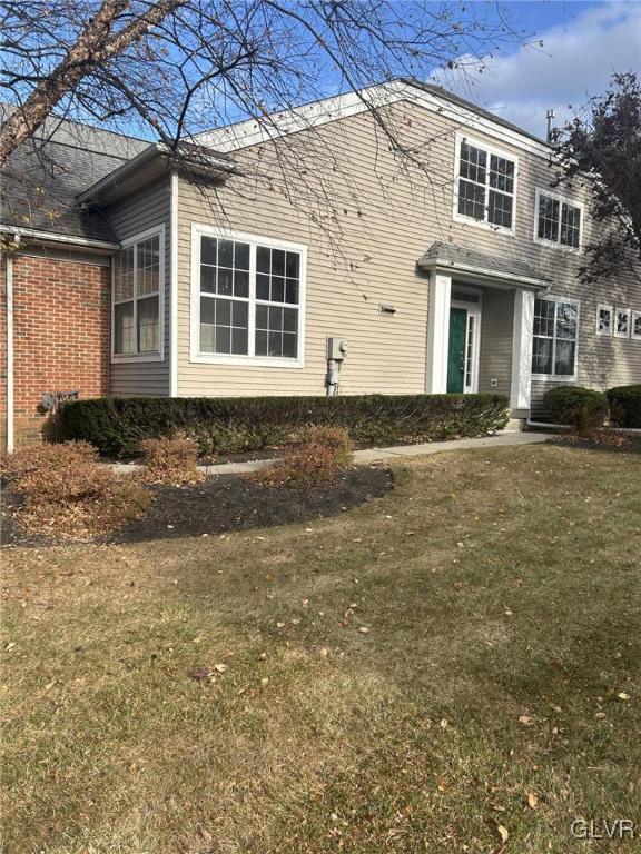 4302 Creek Road Allentown, PA 18104 - Photo 2 of 18 a front view of a house with a garden