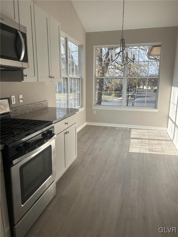4302 Creek Road Allentown, PA 18104 - Photo 6 of 18 a kitchen with granite countertop a stove and a microwave