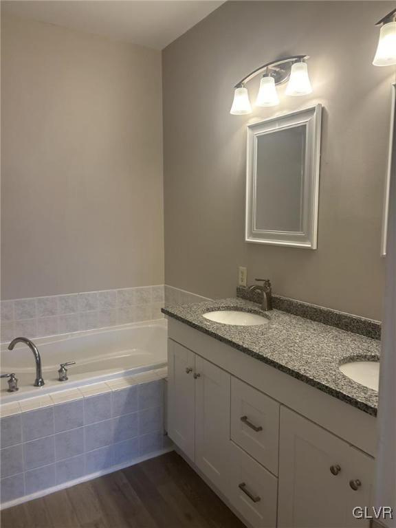 4302 Creek Road Allentown, PA 18104 - Photo 9 of 18 a bathroom with a granite countertop sink mirror and bathtub