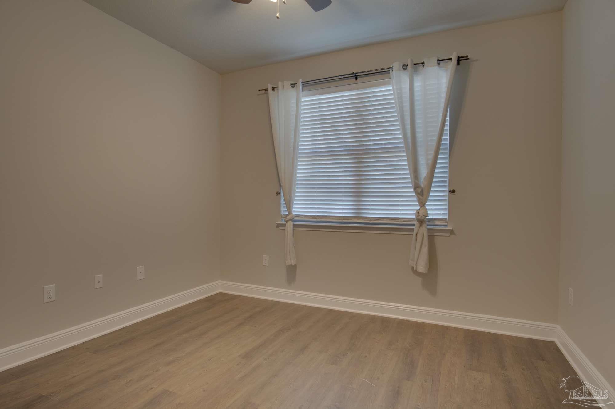 6239 Ladera Trail Pace, FL 32571 - Photo 21 of 27 a view of a room that has a window in it