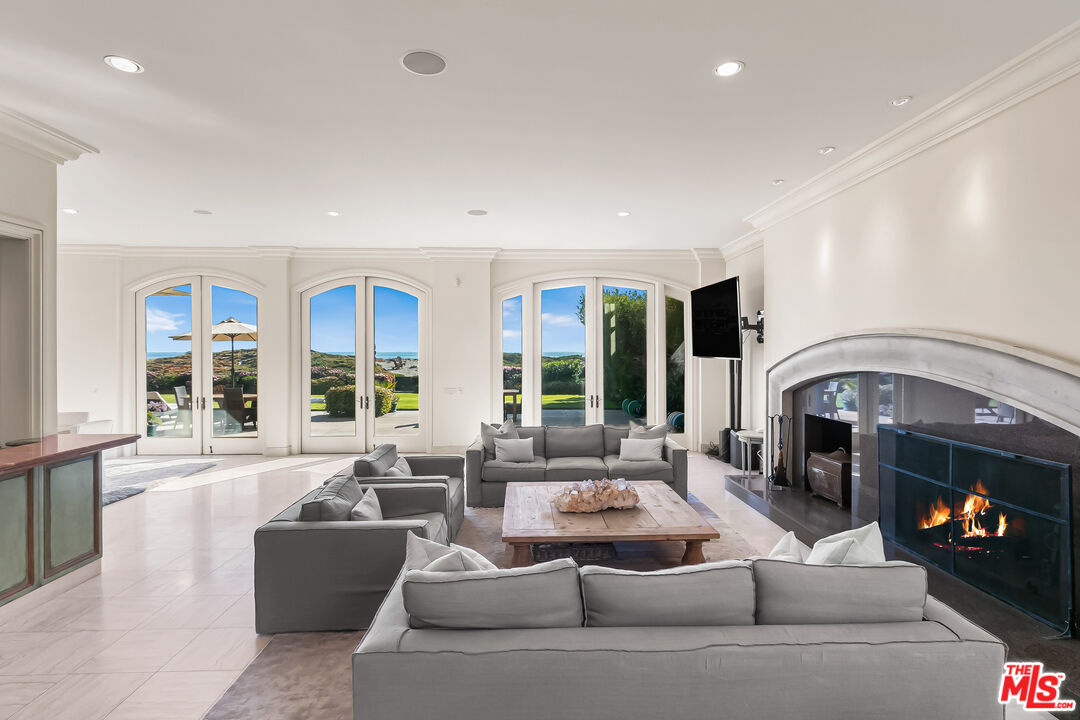 0 Broad Beach Road Malibu, CA 90265 - Photo 20 of 54 a living room with furniture and a fireplace