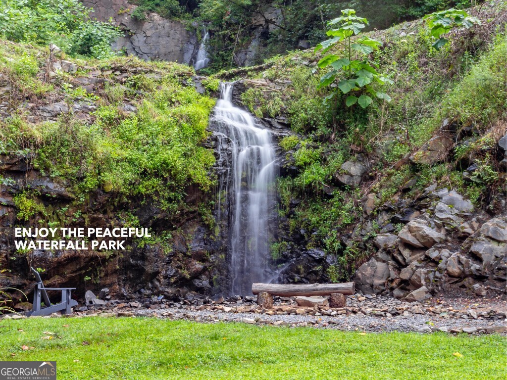 93 High Chapperal Crest Murphy, NC 28906 - Photo 3 of 12 a view of a garden with a bench