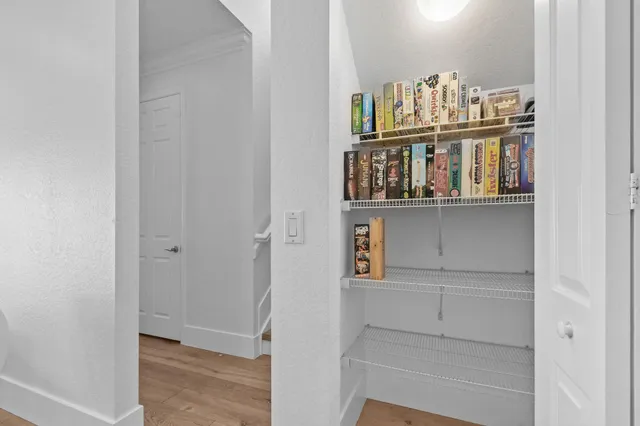 a kitchen with stainless steel appliances white cabinets and a stove