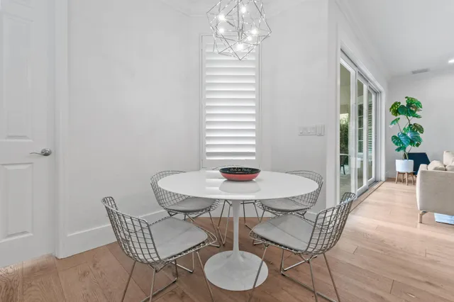 a bathroom with a granite countertop sink a mirror a shower and a bathtub