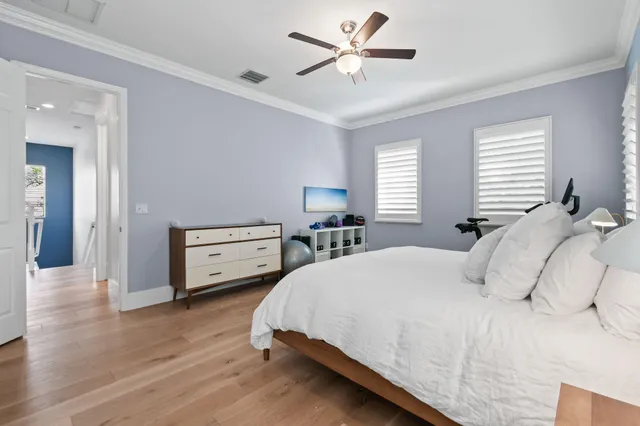 a bedroom with a bed and a lamp