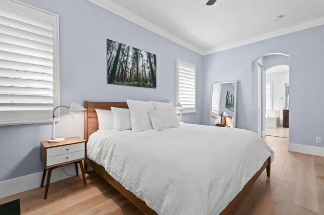 a bedroom with a bed and a desk in it