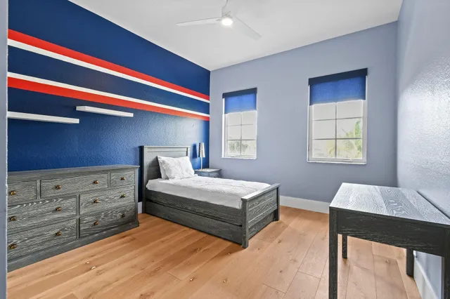 an aerial view of residential houses with outdoor space and river