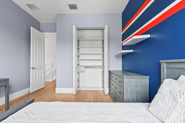 a view of a livingroom with workspace and a couch