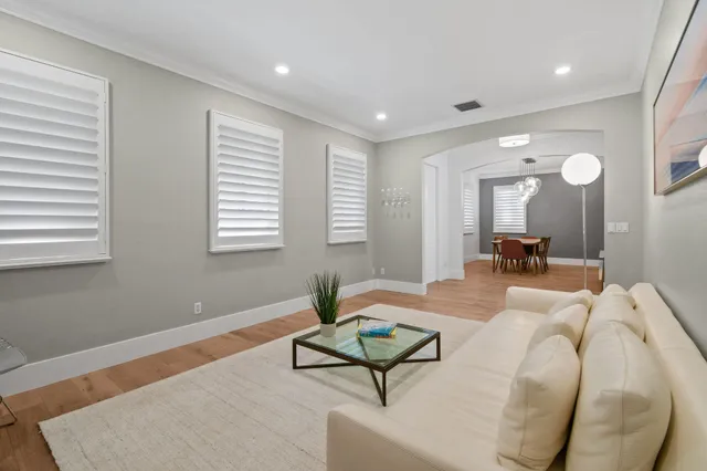 a living room with furniture and a rug