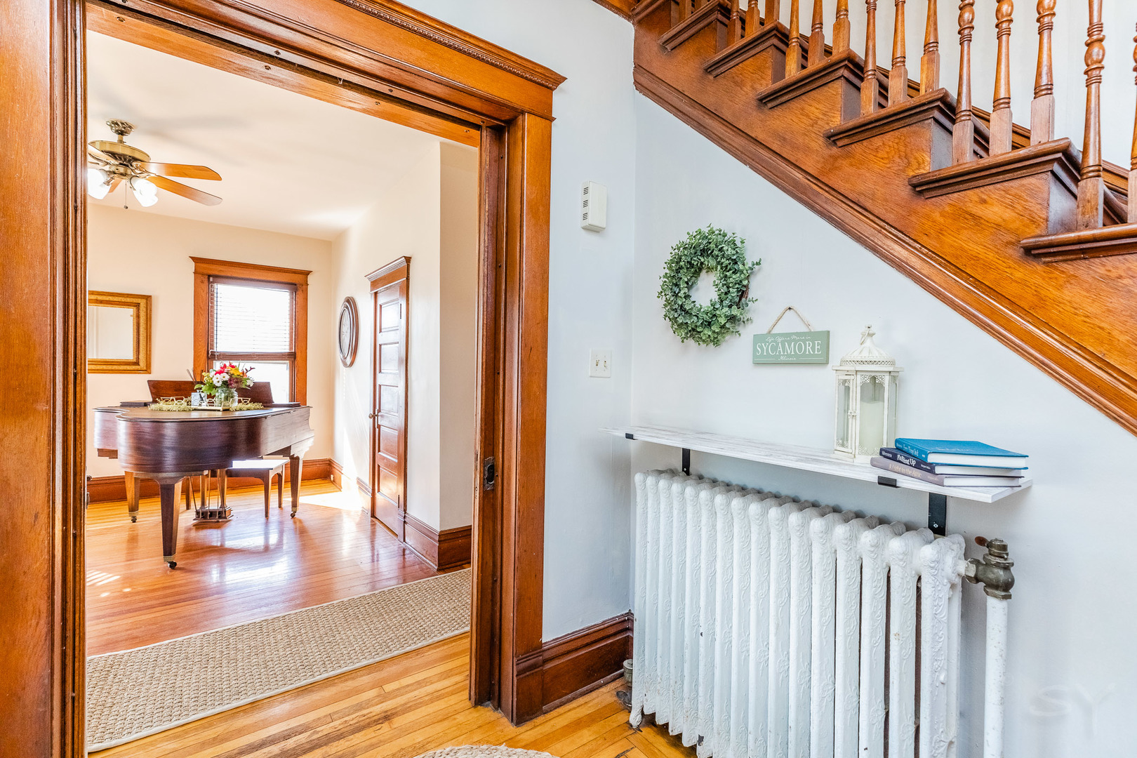 121 Mason Court Sycamore, IL 60178 - Photo 5 of 38 a view of a porch with wooden floor and a potted plant