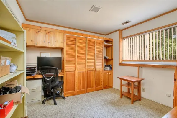 a workspace with furniture and a window