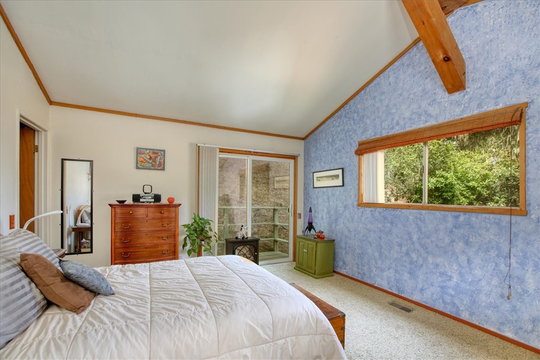 910 Sheffield Street Cambria, CA 93428 - Photo 16 of 29 a bedroom with a bed and a large window