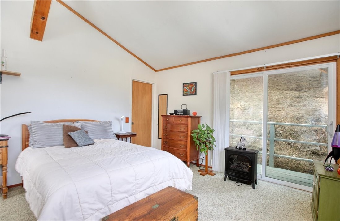 910 Sheffield Street Cambria, CA 93428 - Photo 19 of 29 a bedroom with a bed and a table