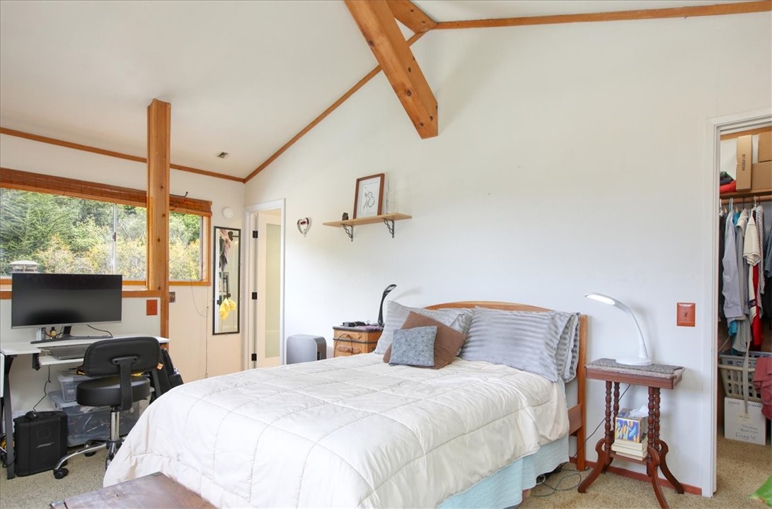 910 Sheffield Street Cambria, CA 93428 - Photo 21 of 29 a bedroom with a bed and a flat screen tv