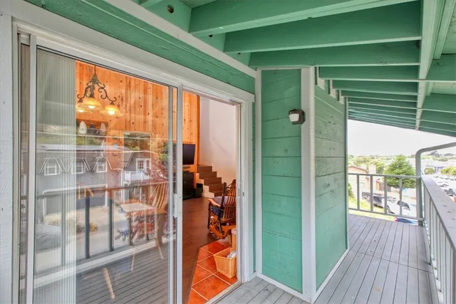 a view of a balcony and floor to ceiling window