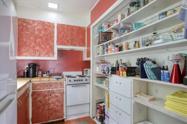 a room with storage and utility cabinets