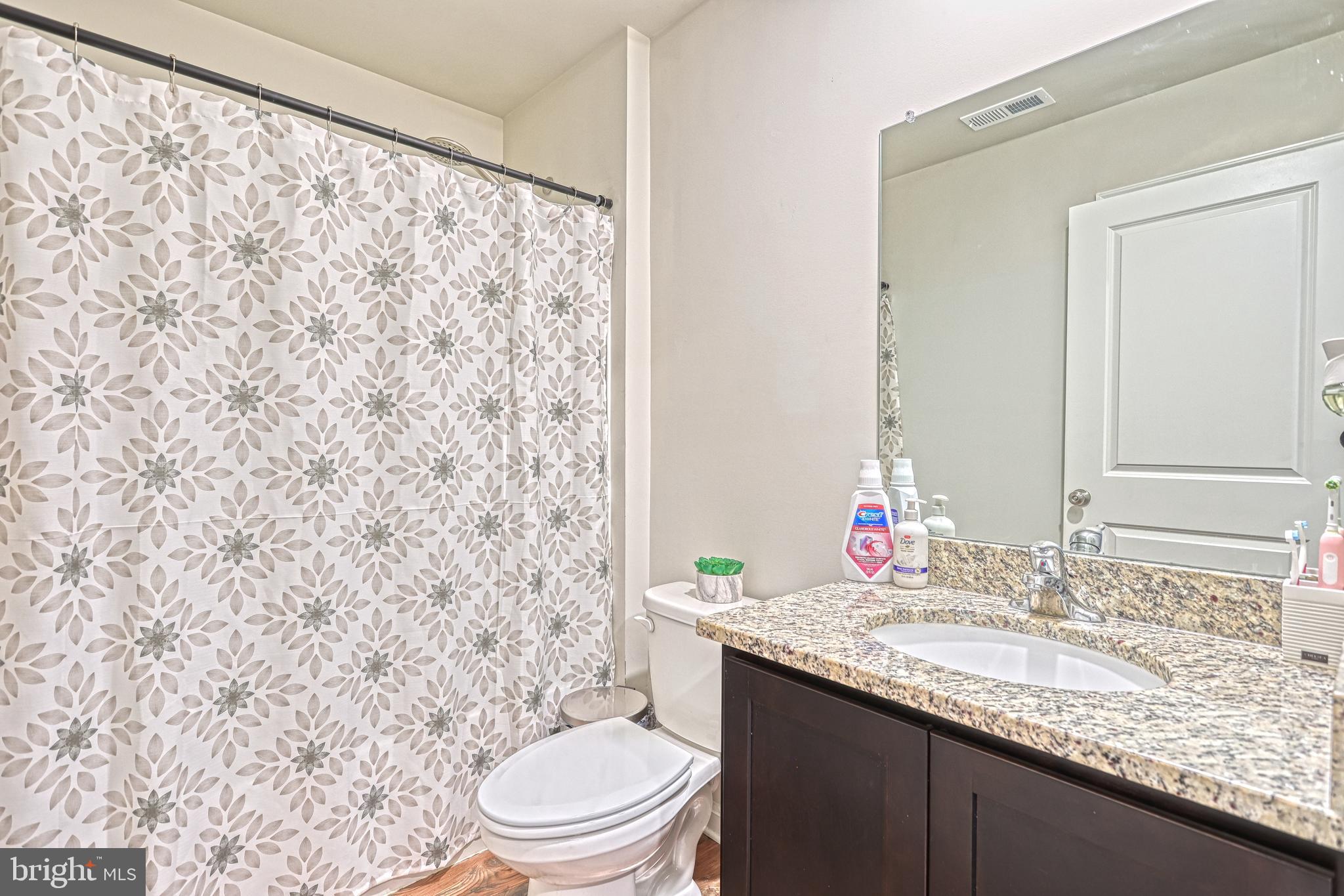 260 Maple Run Drive York, PA 17404 - Photo 23 of 31 a bathroom with a granite countertop sink toilet and mirror