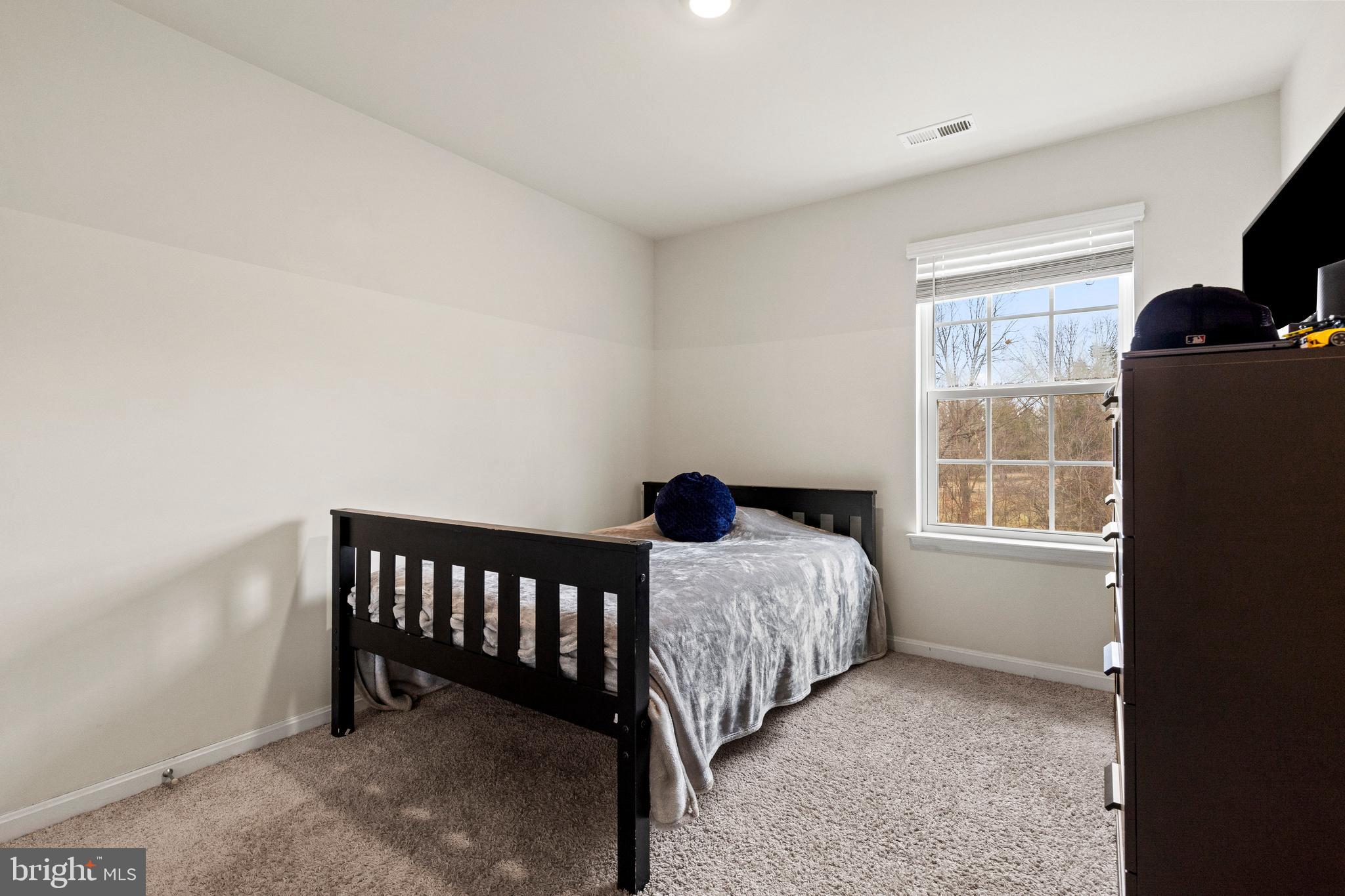 260 Maple Run Drive York, PA 17404 - Photo 24 of 31 a bedroom with a bed and a window