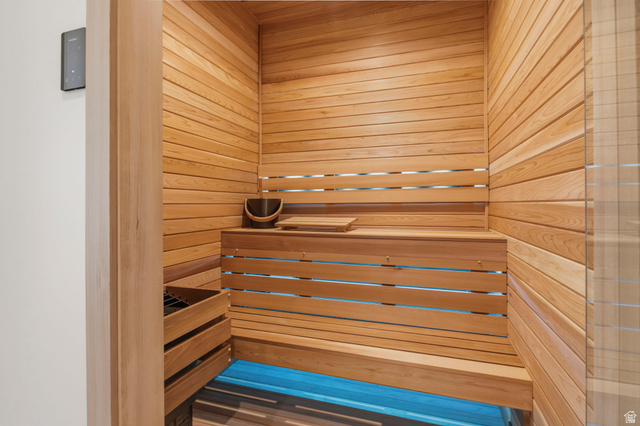 115 East Hidden Ridge Lane, Unit 42 Mapleton, UT 84664 - Photo 76 of 103 Custom sauna featuring horizontal wood paneling, built-in wooden benches, and a wood-slatted heater enclosure