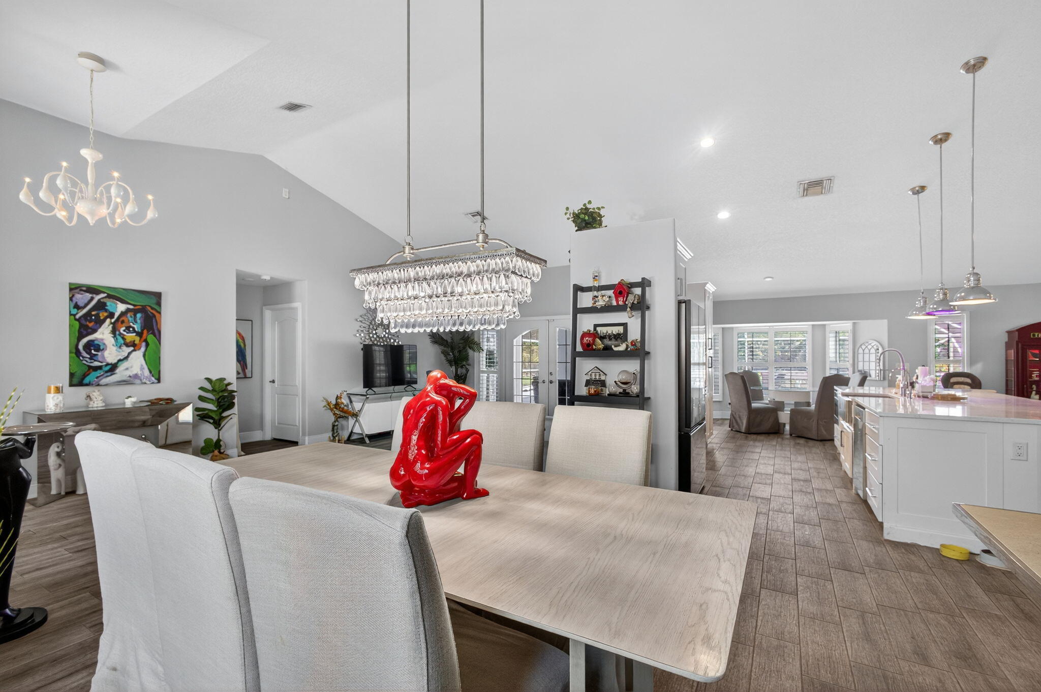13033 160th Road North Jupiter, FL 33478 - Photo 13 of 79 a living room with furniture and a chandelier