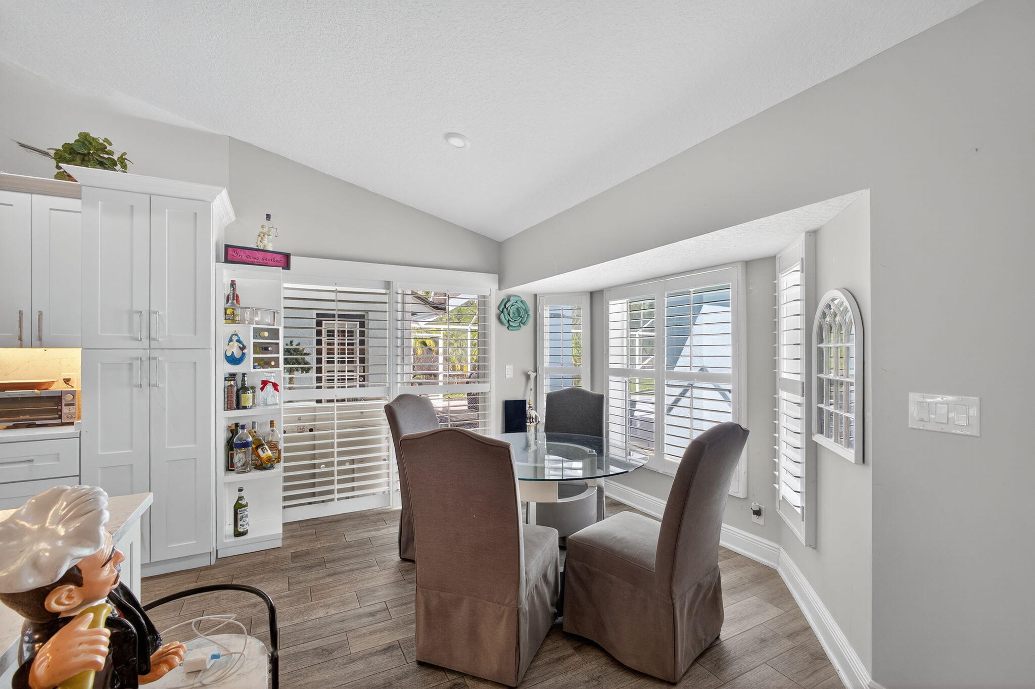 13033 160th Road North Jupiter, FL 33478 - Photo 17 of 79 a view of a dining room with furniture window and outside view