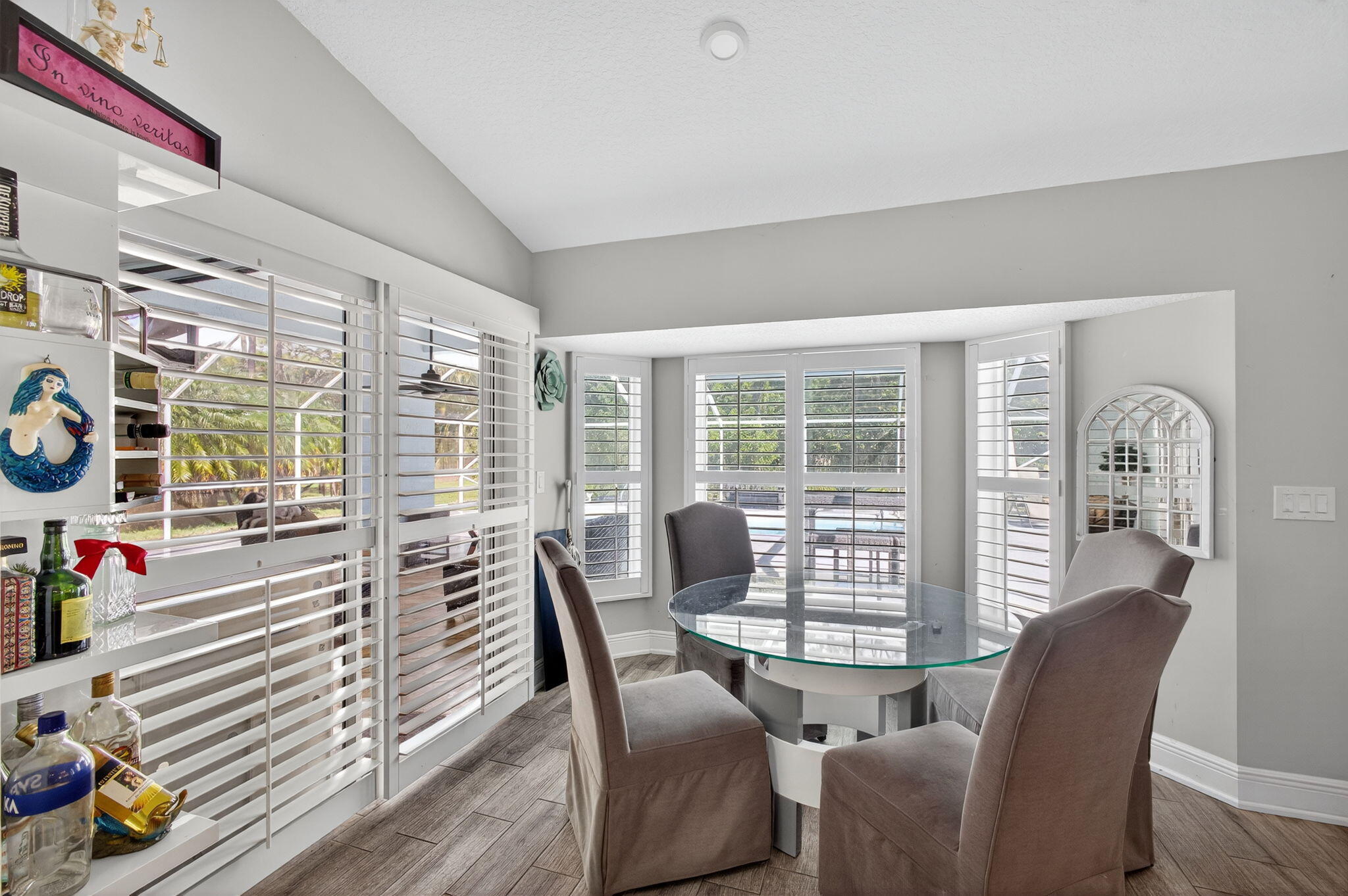 13033 160th Road North Jupiter, FL 33478 - Photo 18 of 79 a view of a livingroom with furniture wooden floor and windows