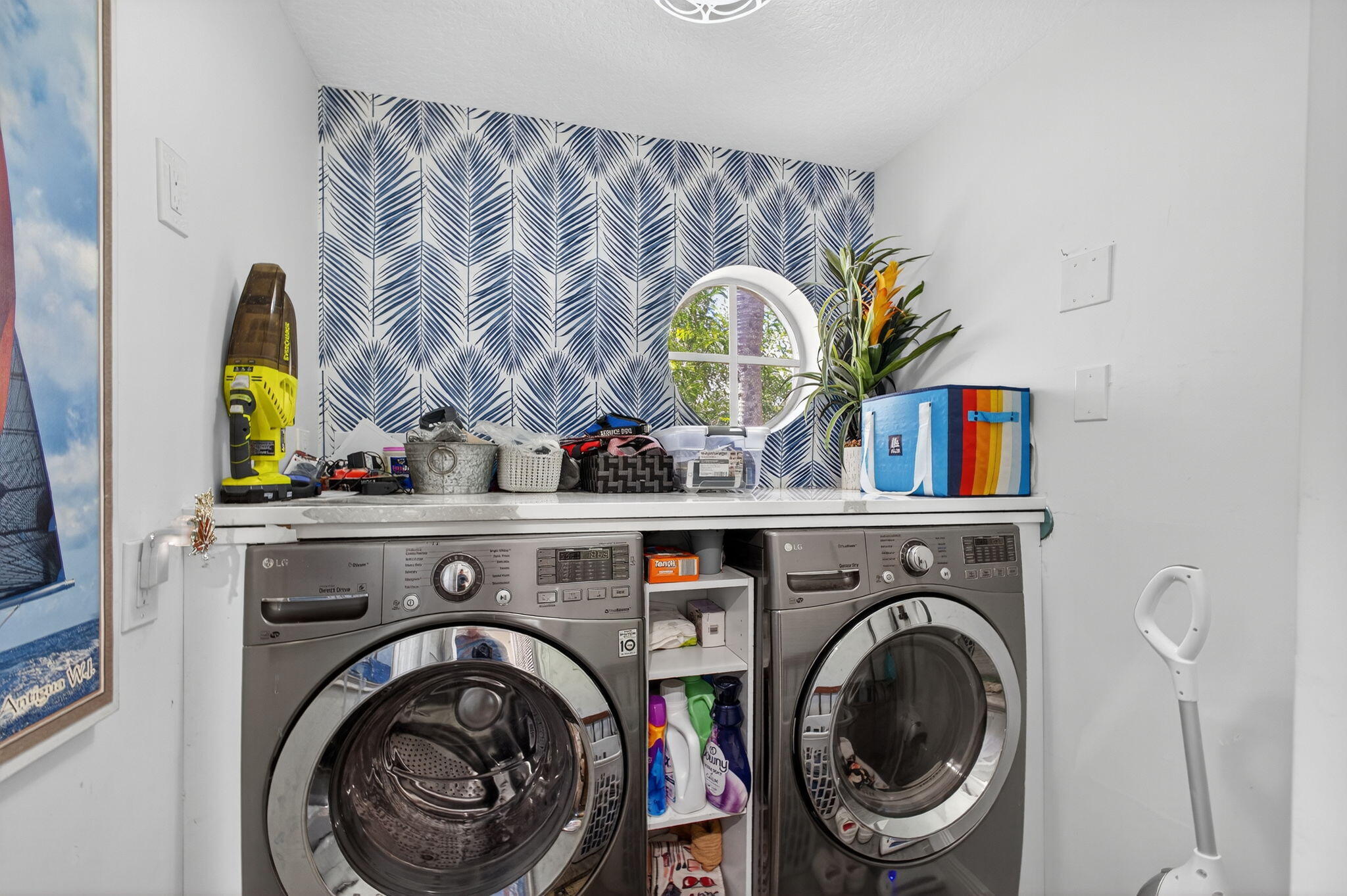 13033 160th Road North Jupiter, FL 33478 - Photo 23 of 79 a view of washer and dryer in a utility room