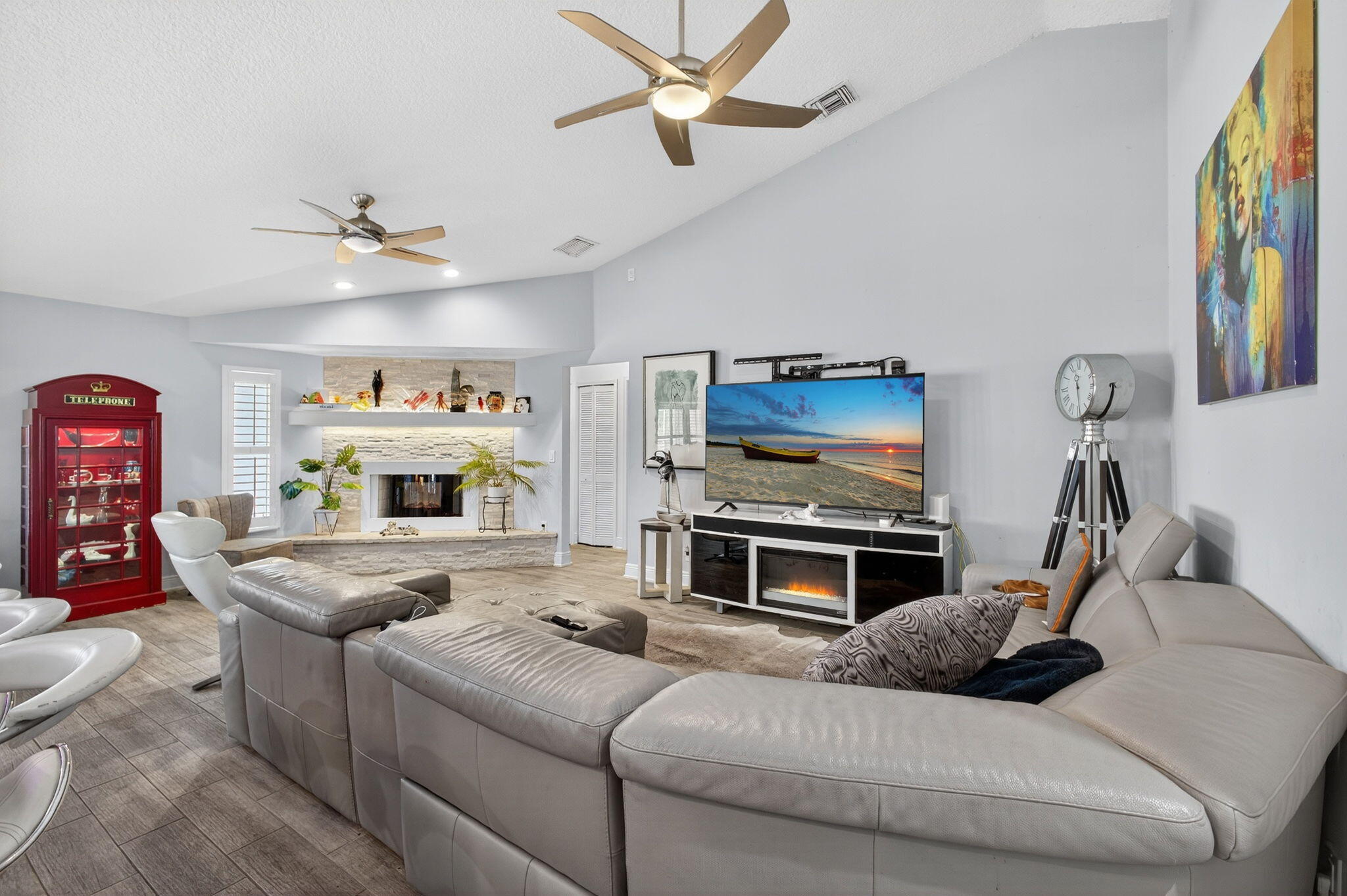 13033 160th Road North Jupiter, FL 33478 - Photo 25 of 79 a living room with furniture and a flat screen tv