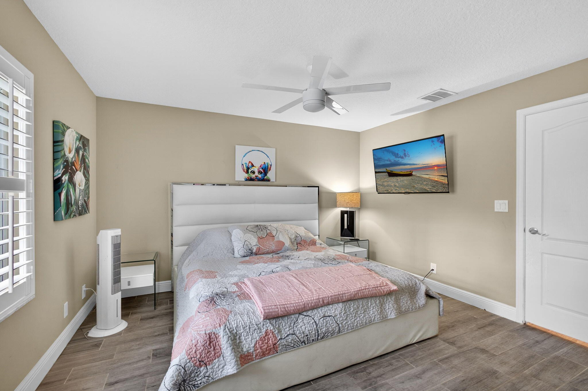 13033 160th Road North Jupiter, FL 33478 - Photo 40 of 79 a bedroom with a large bed a chandelier and dresser