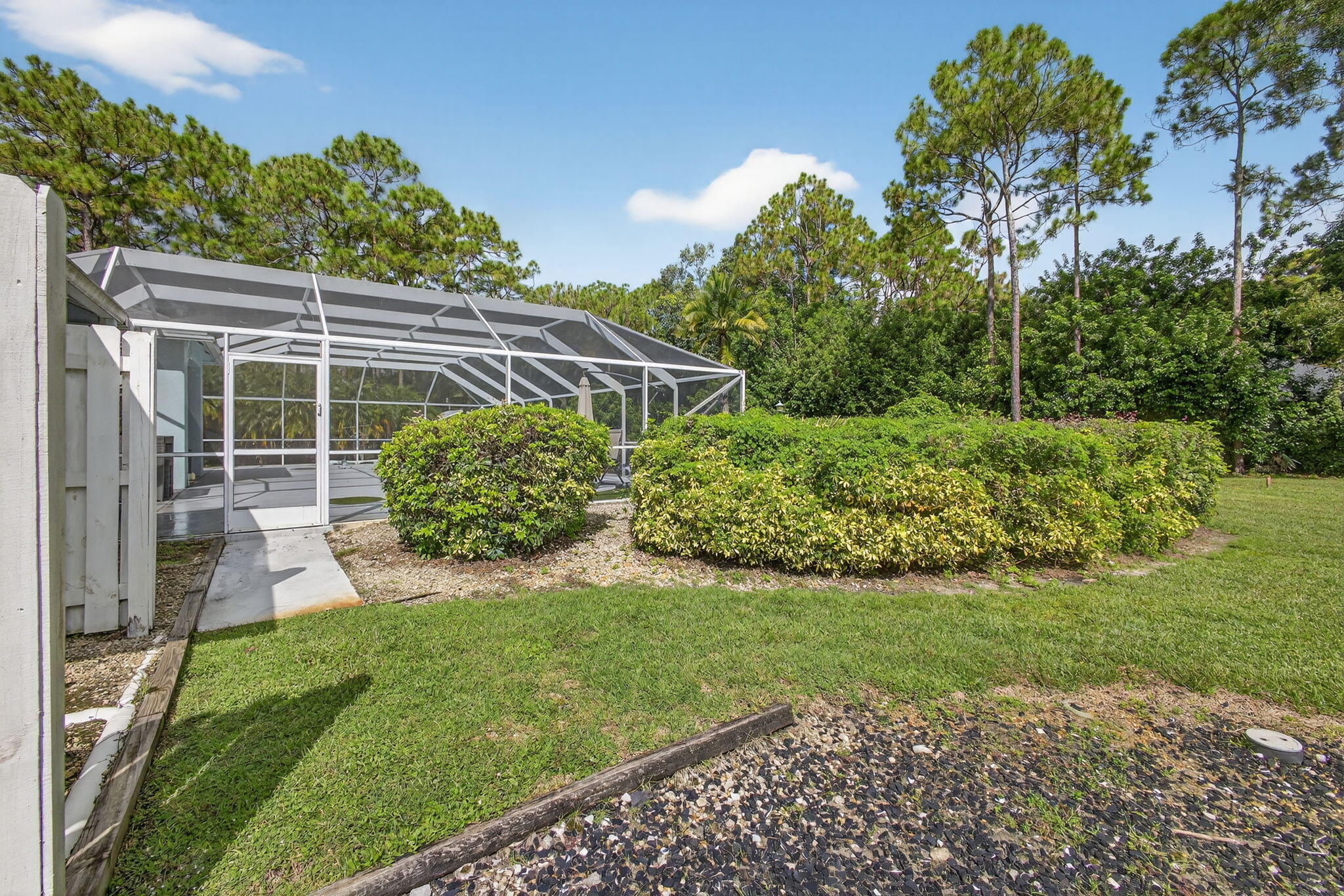 13033 160th Road North Jupiter, FL 33478 - Photo 49 of 79 a view of a backyard with plants