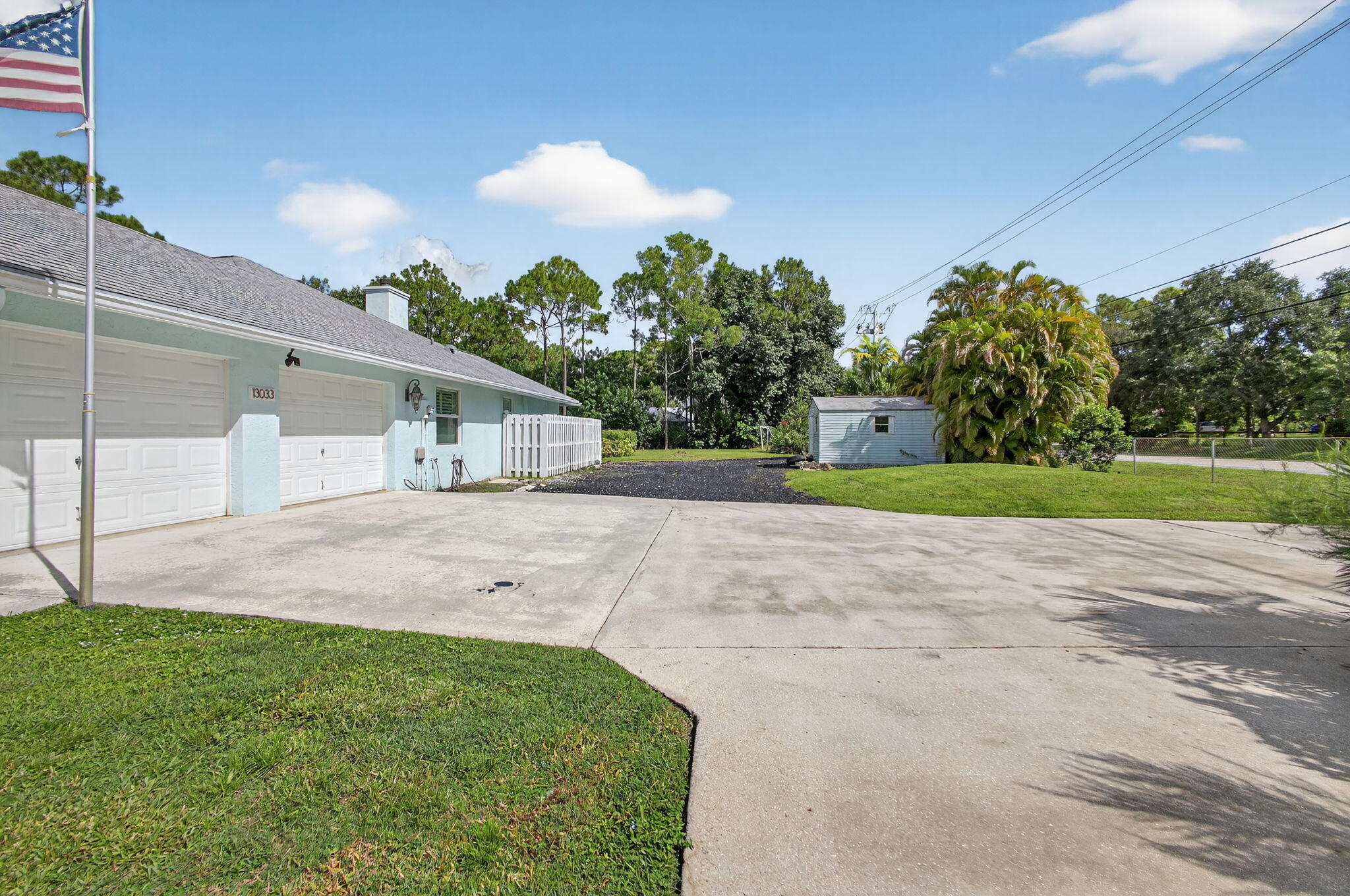13033 160th Road North Jupiter, FL 33478 - Photo 60 of 79 a front view of house with yard and green space