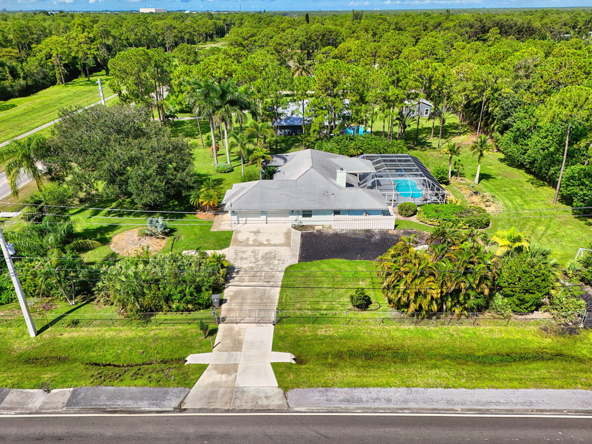 13033 160th Road North Jupiter, FL 33478 - Photo 68 of 79 an aerial view of a house with a yard