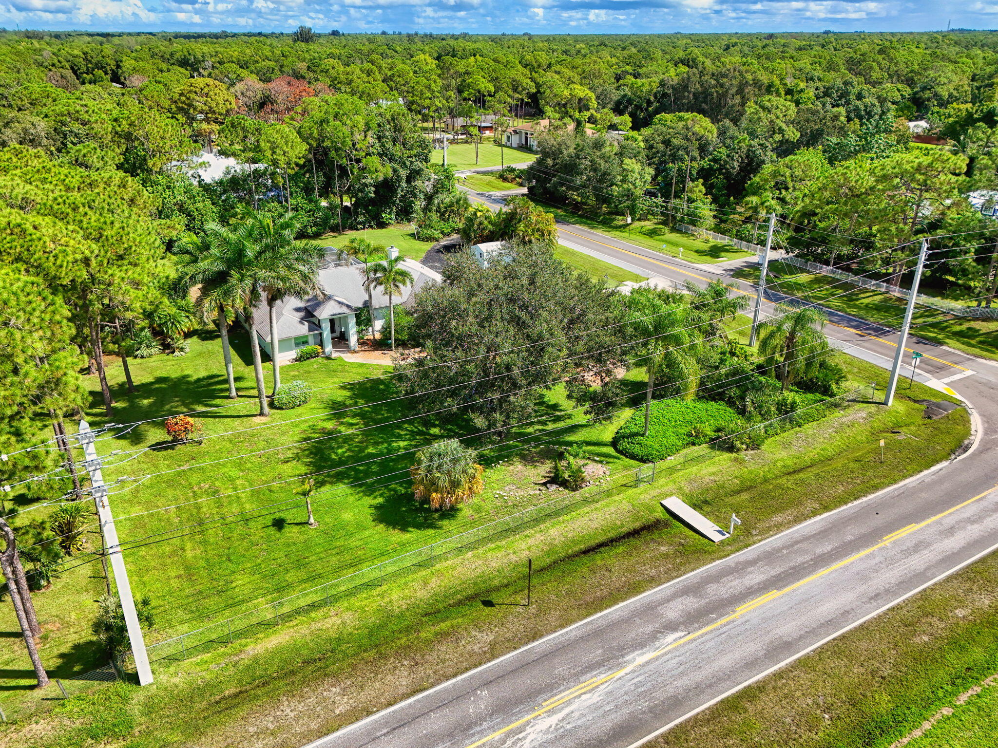 13033 160th Road North Jupiter, FL 33478 - Photo 70 of 79 a view of a garden with a pathway