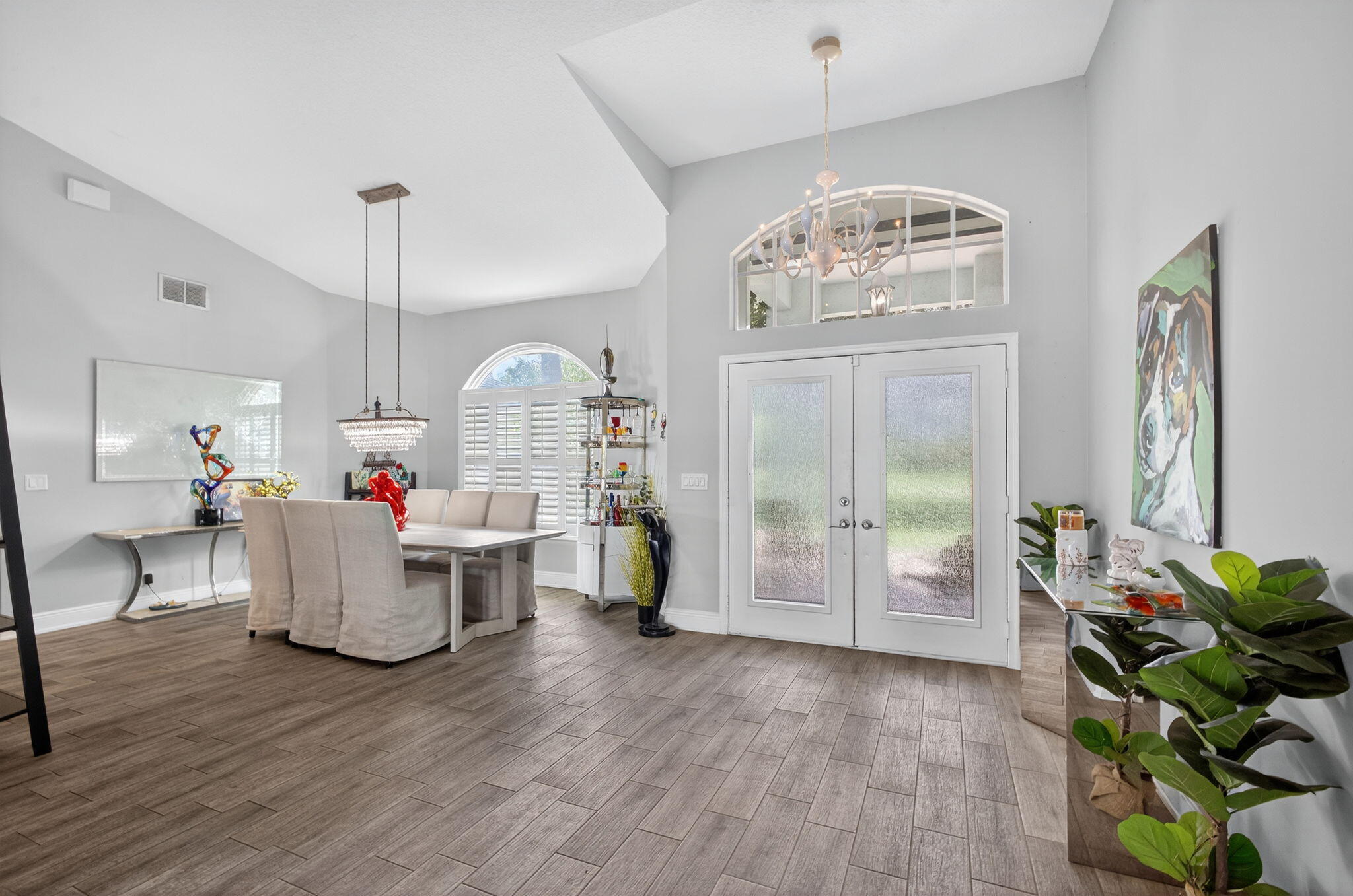13033 160th Road North Jupiter, FL 33478 - Photo 7 of 79 a living room with fireplace furniture and a chandelier