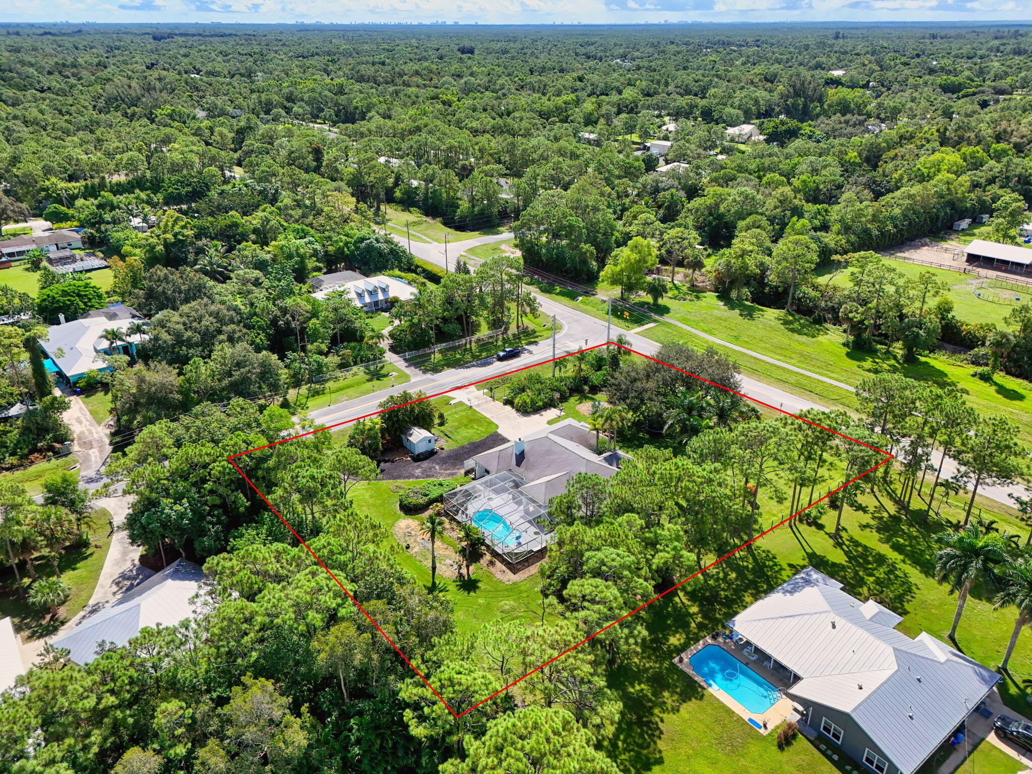 13033 160th Road North Jupiter, FL 33478 - Photo 77 of 79 an aerial view of a house with a yard