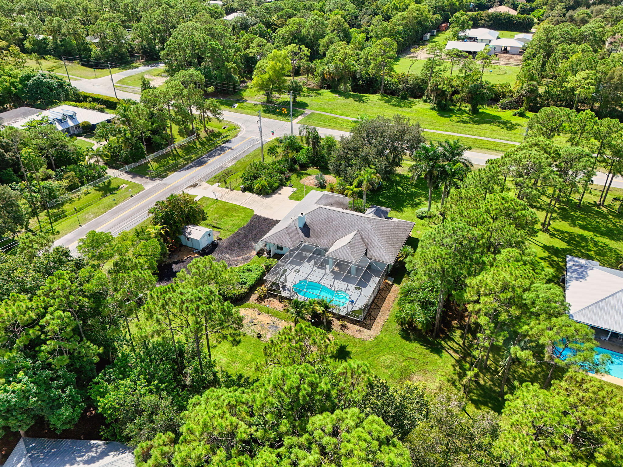 13033 160th Road North Jupiter, FL 33478 - Photo 78 of 79 an aerial view of residential house with outdoor space and trees all around