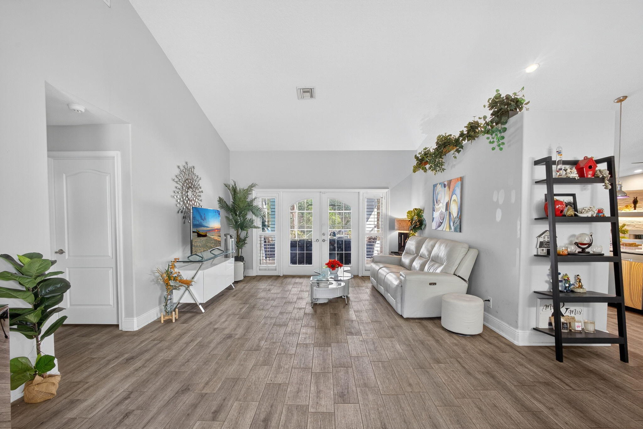 13033 160th Road North Jupiter, FL 33478 - Photo 9 of 79 a living room with furniture and a wooden floor