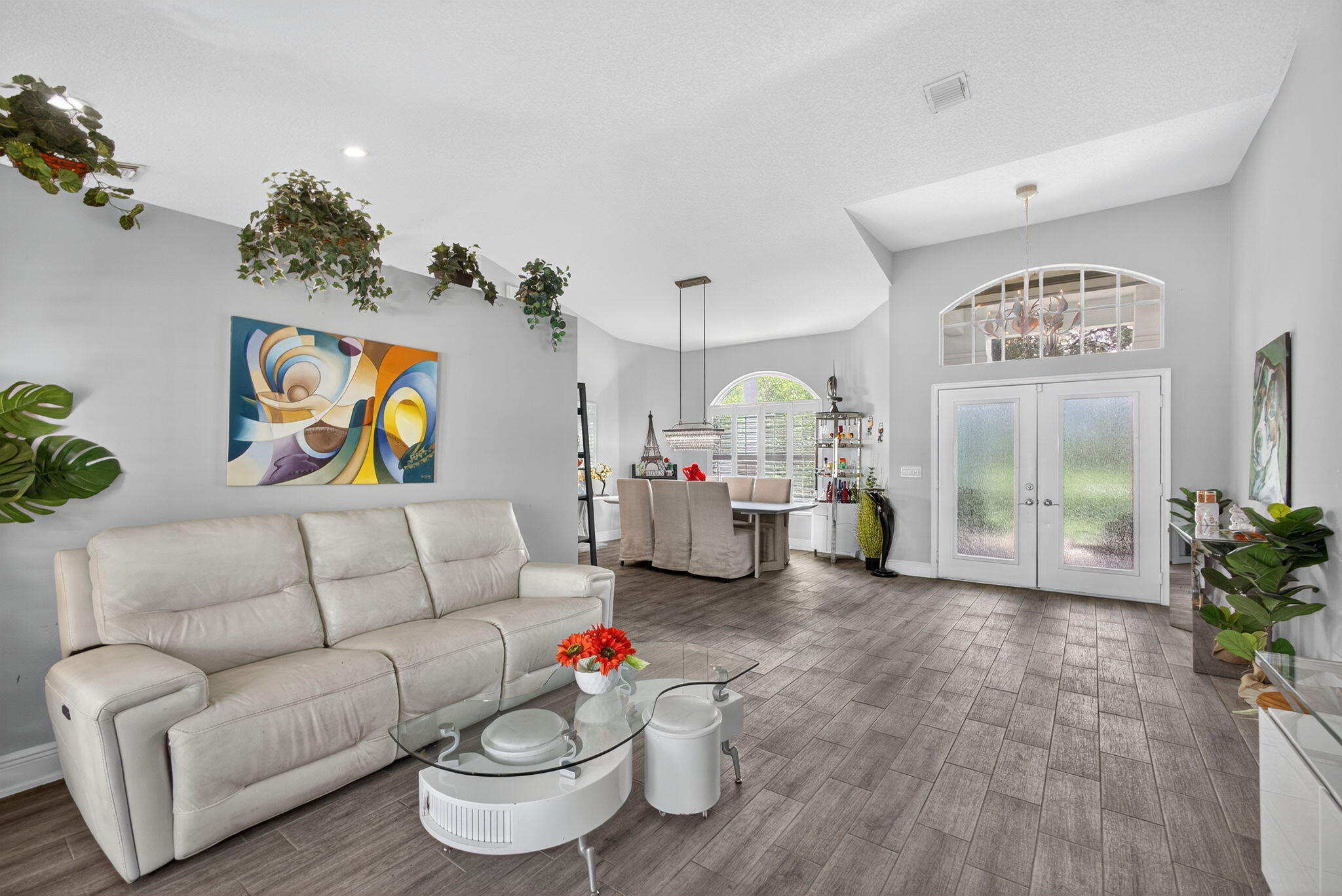 13033 160th Road North Jupiter, FL 33478 - Photo 10 of 79 a living room with furniture and a potted plant