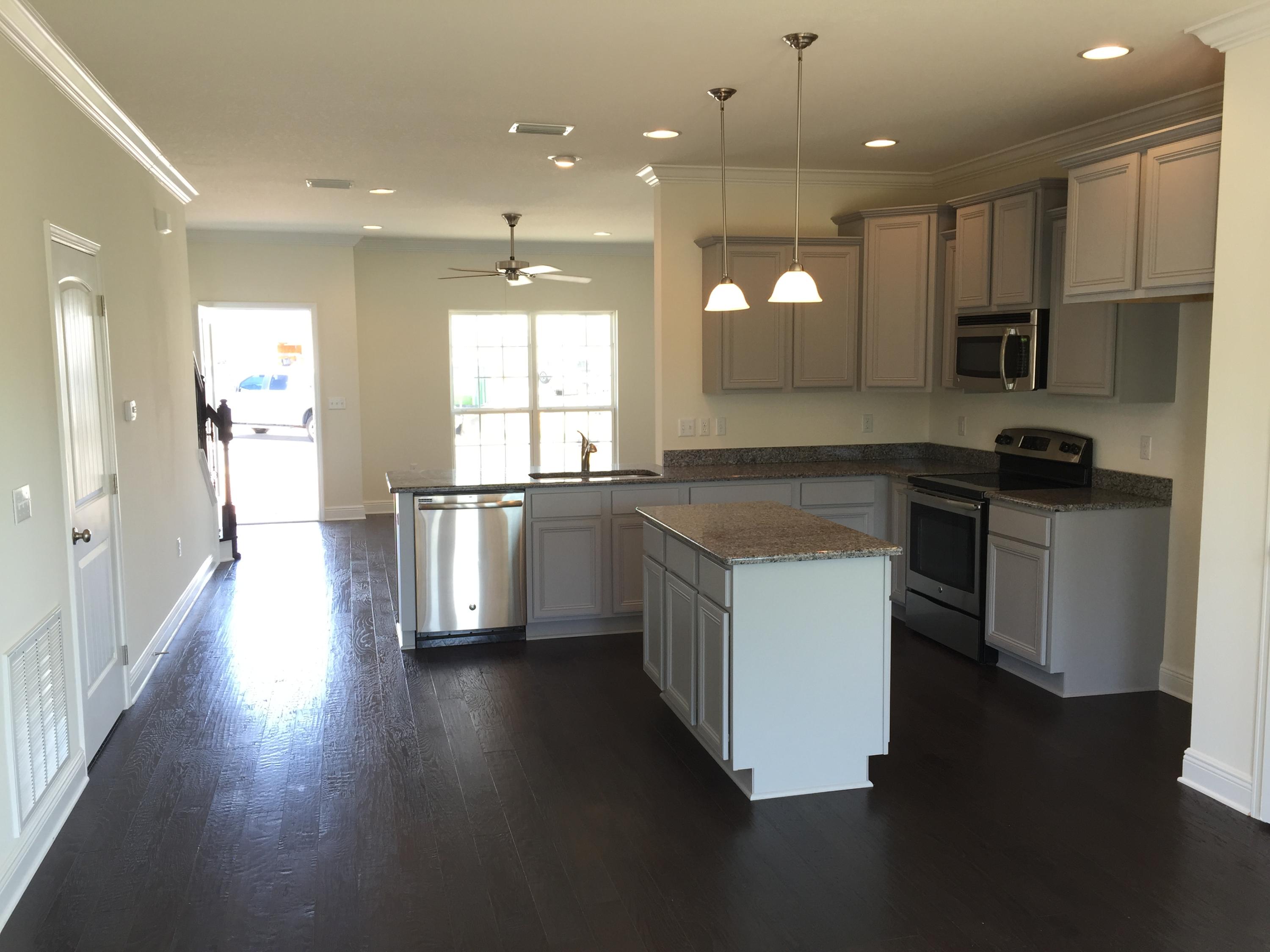 77 Grayling Way Inlet Beach, FL 32461 - Photo 8 of 25 a kitchen with a sink a counter top space stainless steel appliances and a window