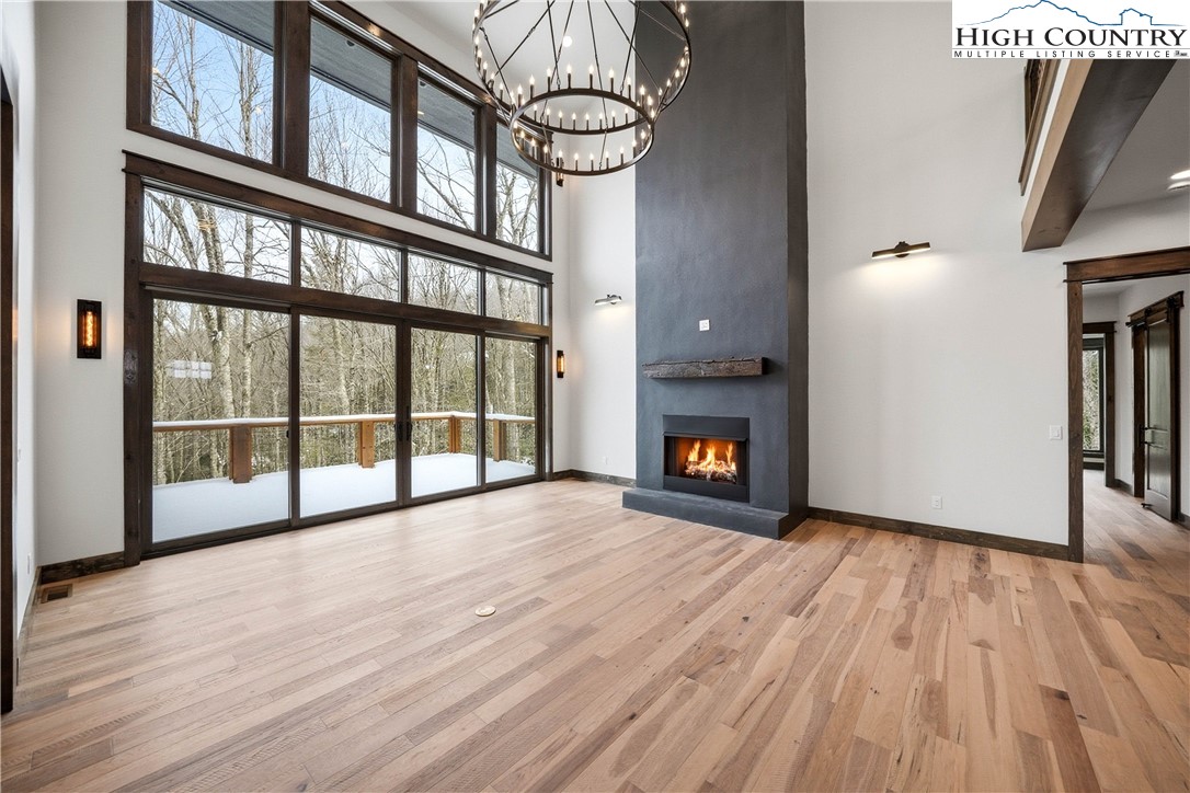 Lot 41 Mossy Creek Boone, NC 28607 - Photo 20 of 49 a view of an empty room with wooden floor and a window