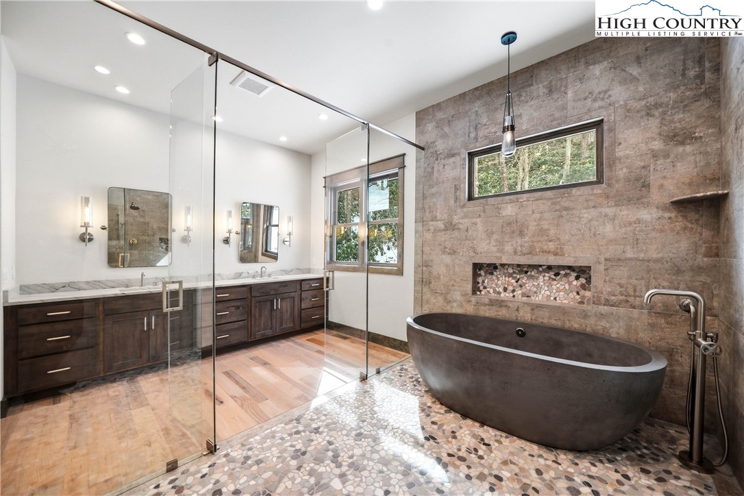 Lot 41 Mossy Creek Boone, NC 28607 - Photo 25 of 49 a large kitchen with stainless steel appliances kitchen island granite countertop a sink and cabinets