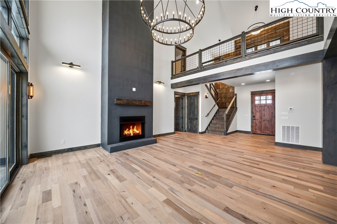 Lot 41 Mossy Creek Boone, NC 28607 - Photo 28 of 49 a view of a livingroom with wooden floor and a fireplace