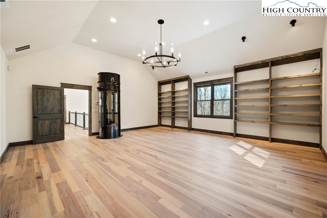 Lot 41 Mossy Creek Boone, NC 28607 - Photo 32 of 49 a view of an empty room with window and wooden floor