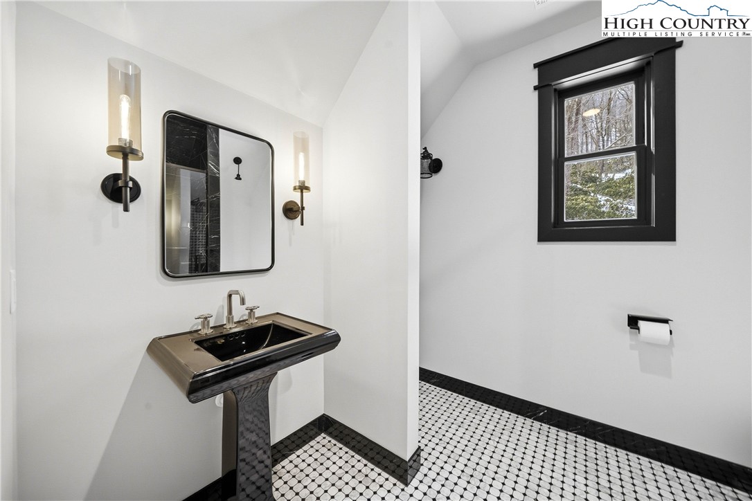 Lot 41 Mossy Creek Boone, NC 28607 - Photo 36 of 49 a bathroom with a sink and a mirror