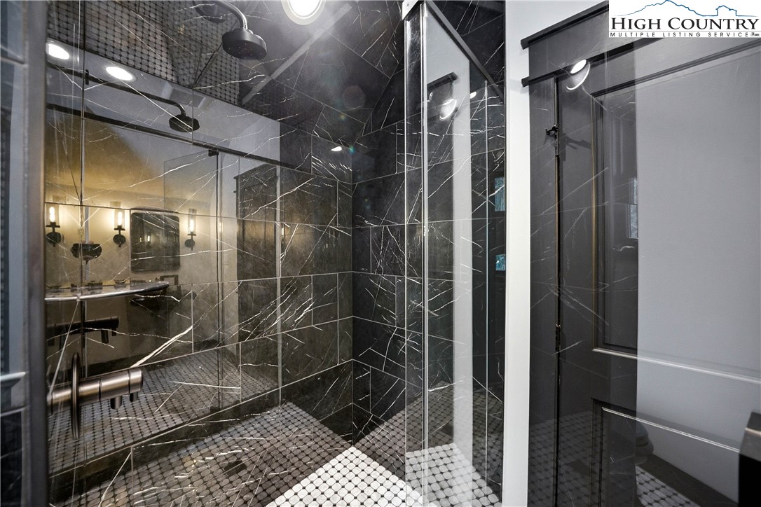 Lot 41 Mossy Creek Boone, NC 28607 - Photo 40 of 49 a bathroom with a glass shower door