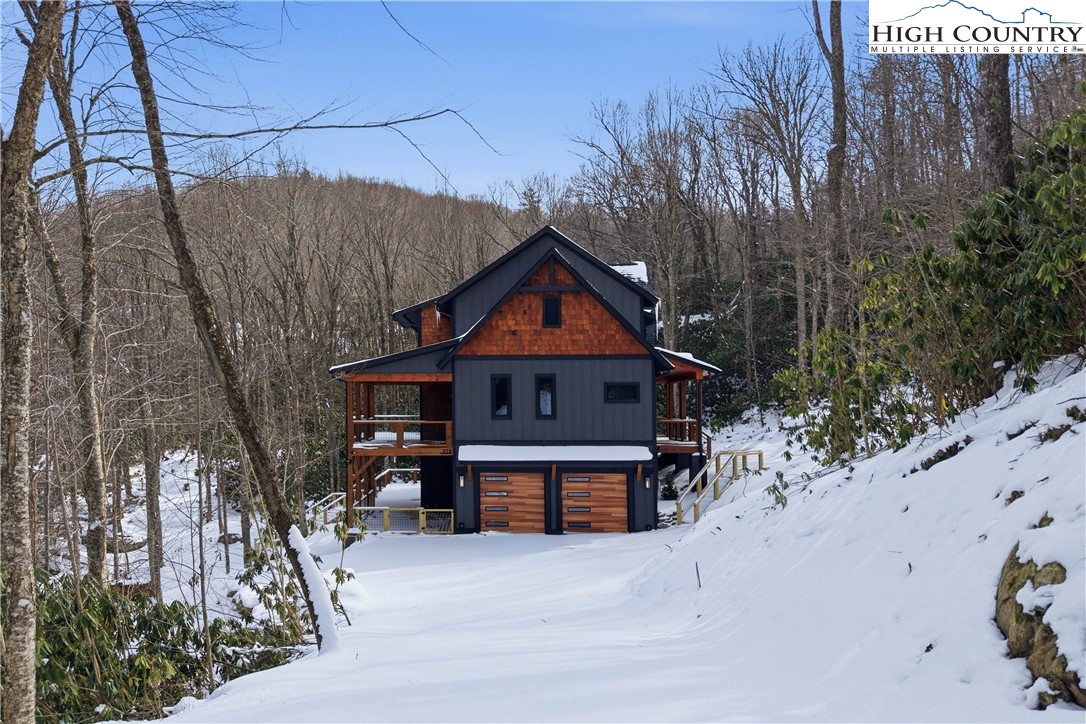 Lot 41 Mossy Creek Boone, NC 28607 - Photo 4 of 49 a front view of a house with a yard