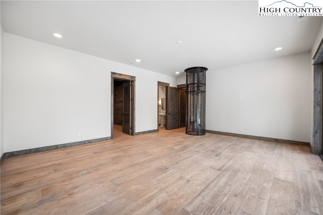 Lot 41 Mossy Creek Boone, NC 28607 - Photo 43 of 49 a view of an empty room with wooden floor