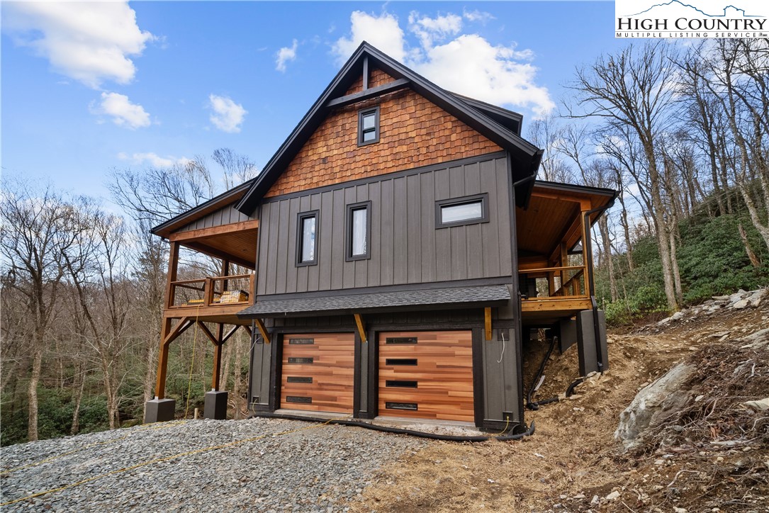 Lot 41 Mossy Creek Boone, NC 28607 - Photo 8 of 49 a front view of a house with garden