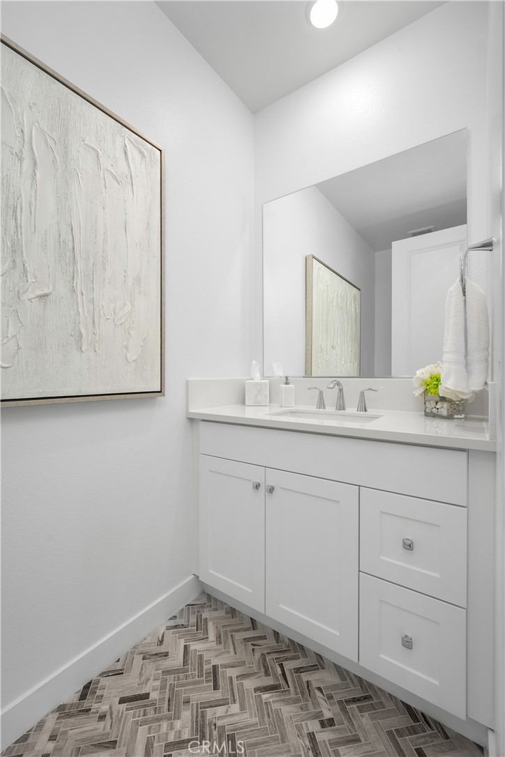 27225 Cranmore Way, Unit 101 Valencia, CA 91381 - Photo 13 of 36 a bathroom with a sink and a mirror
